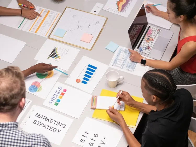 Team analyzing marketing trends and charts using Zuhio Keyword Count Checker strategy