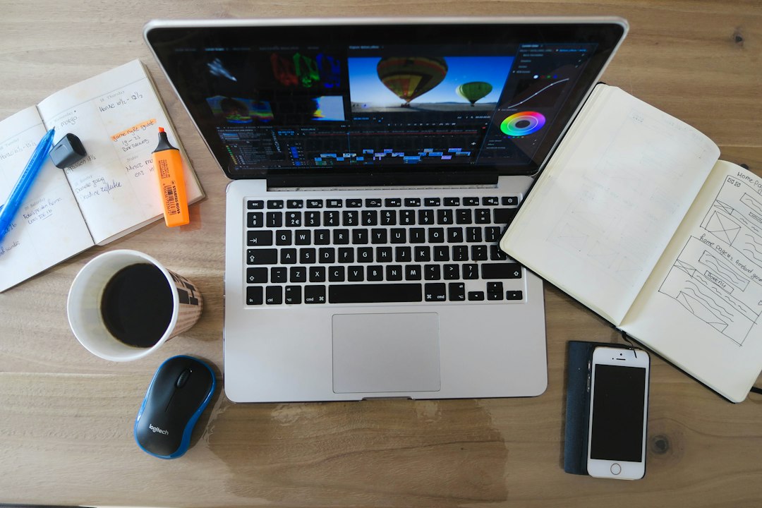 Creative workspace with a laptop and digital editing tools