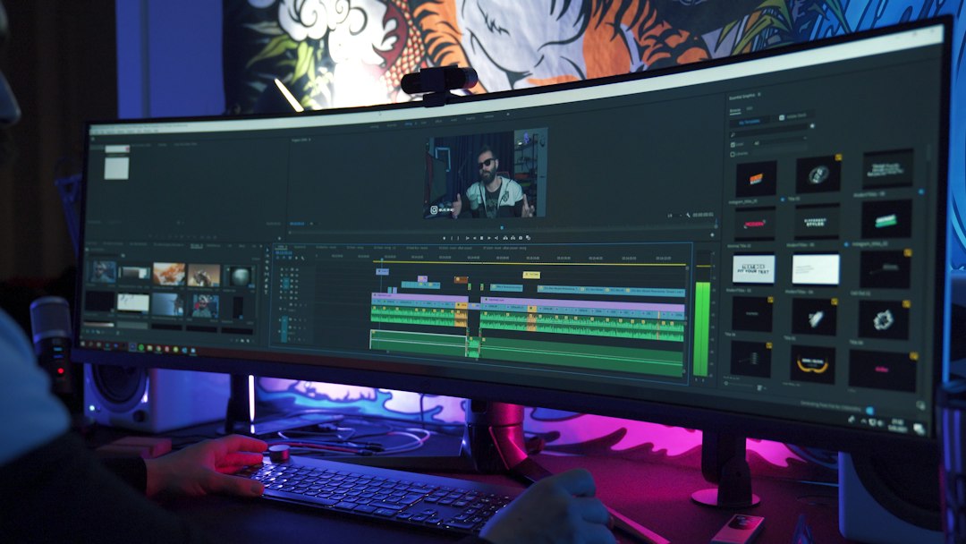 Video editor working at a computer workstation
