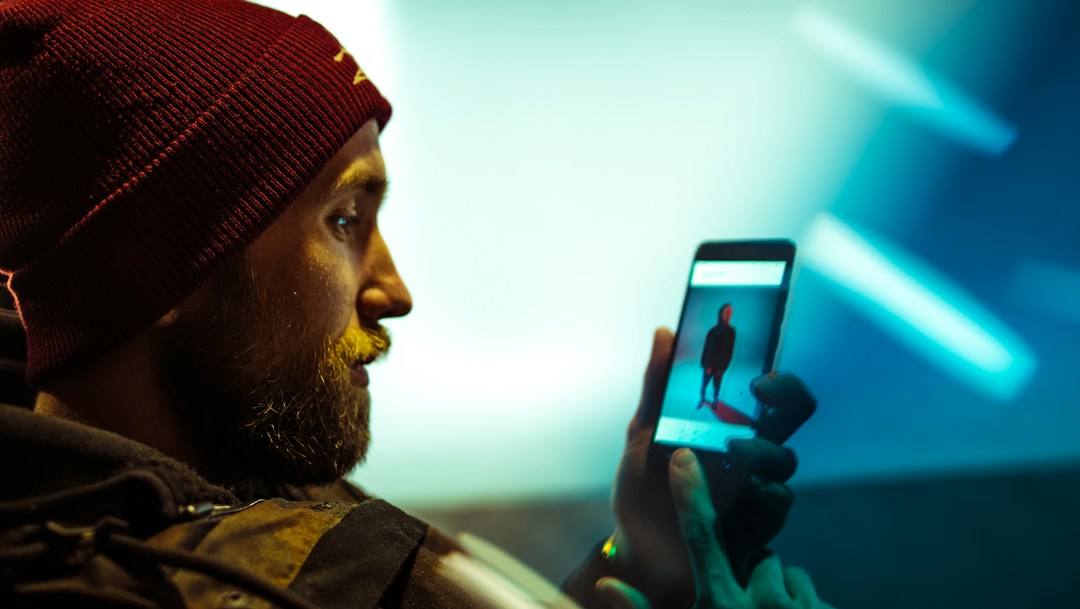 Person using a smartphone for AI chat