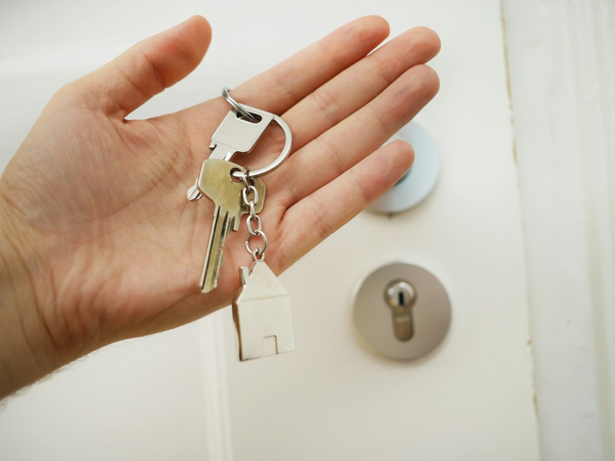 Renter holding a key to an apartment