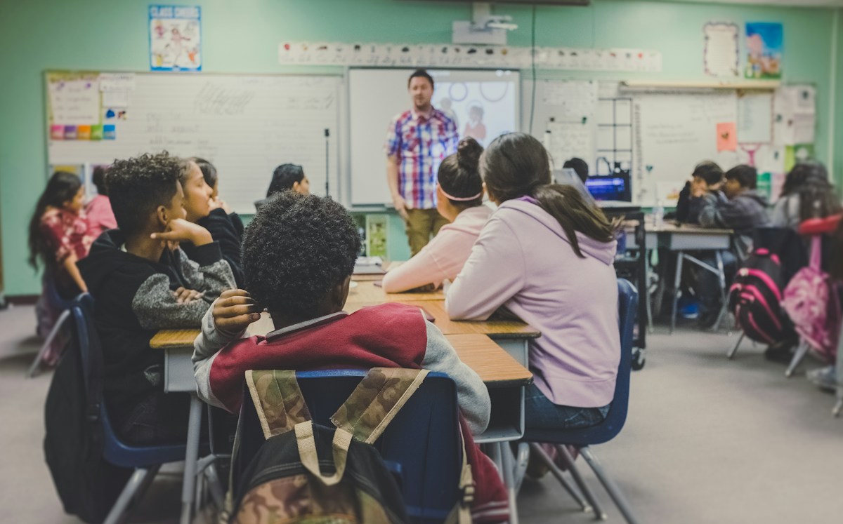 Teacher using technology in a classroom
