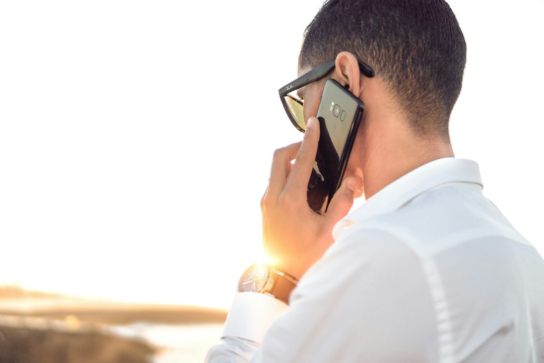 Person checking an unknown phone call on a smartphone