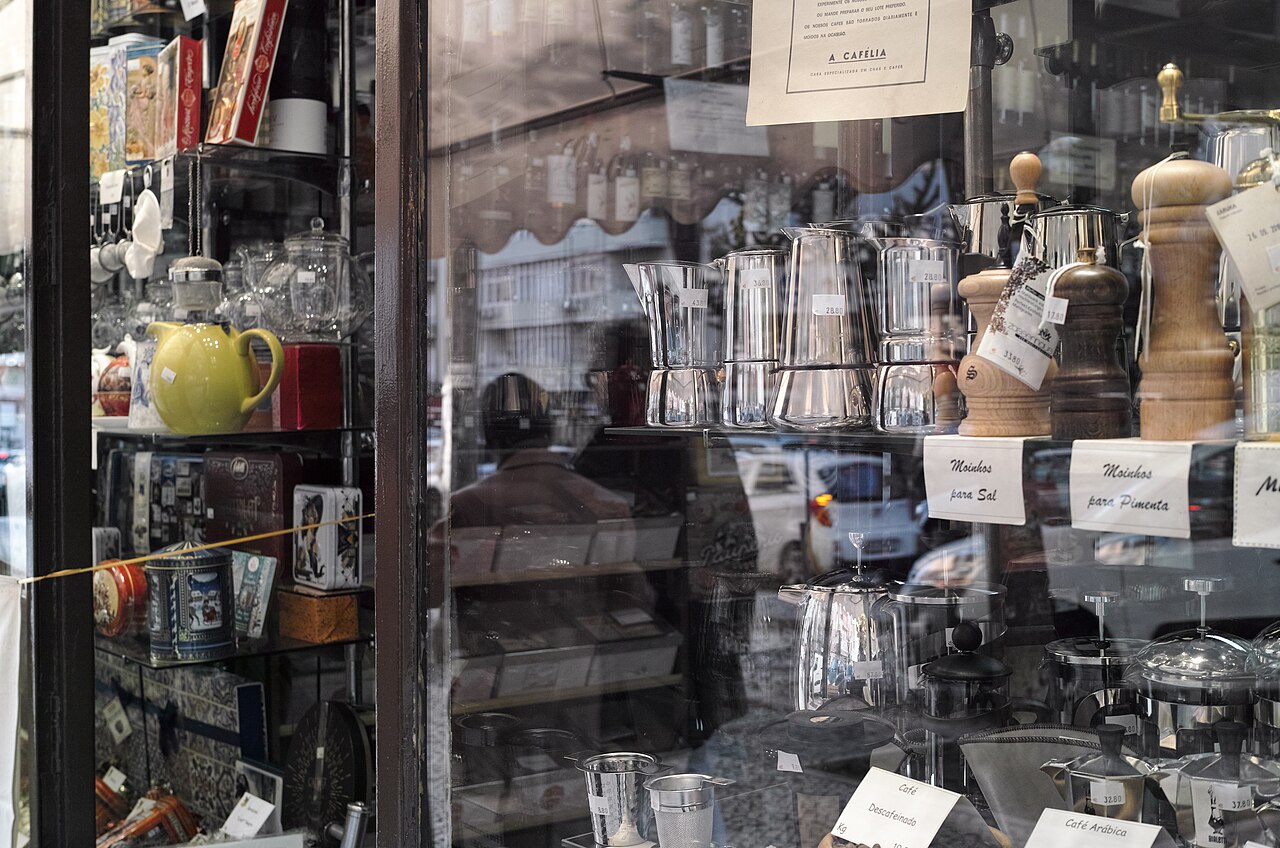 A cafe storefront with a sign above the door