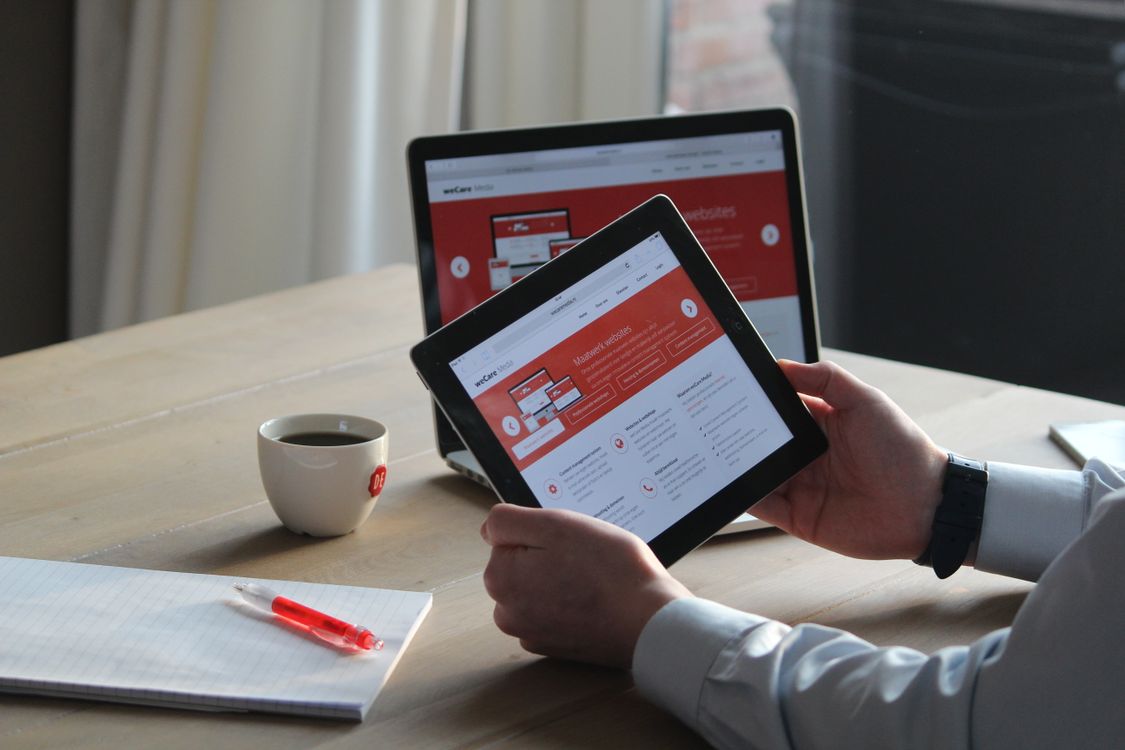 A landing page viewed on a tablet and laptop showing responsive design